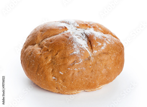 Homemade whole round bread sprinkled with flour