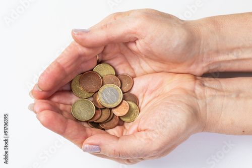 Two hands holding coins