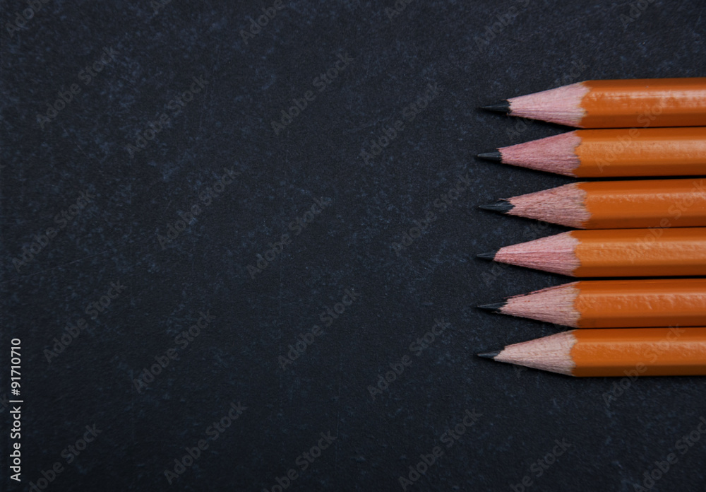 Pencils set on a school blackboard Pencils set on a school blackboard