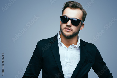 Handsome young man in stylish jacket. Office worker. Successful businessman