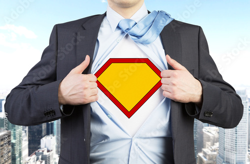 фотографія Businessman in a suit is tearing the shirt