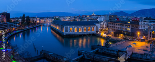 Panoramic of Geneva at the blue hour, the Seujet dam, the Rhone river and the city