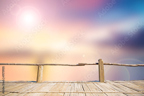 Abstract soft and blur background of sunset at the sea with bamboo terrace