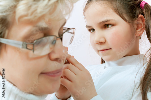 Doctor examining a child in a hospital photo