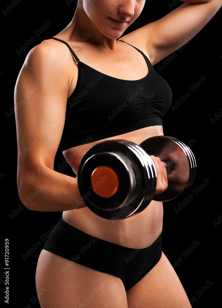 Athletic girl with dumbbells in hand. Athletic girl with dumbbells in hand.