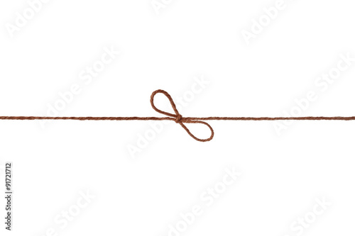 String or twine tied in a bow isolated on white background