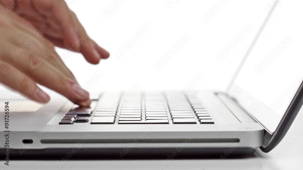 Fingers typing on a laptop Keyboard
