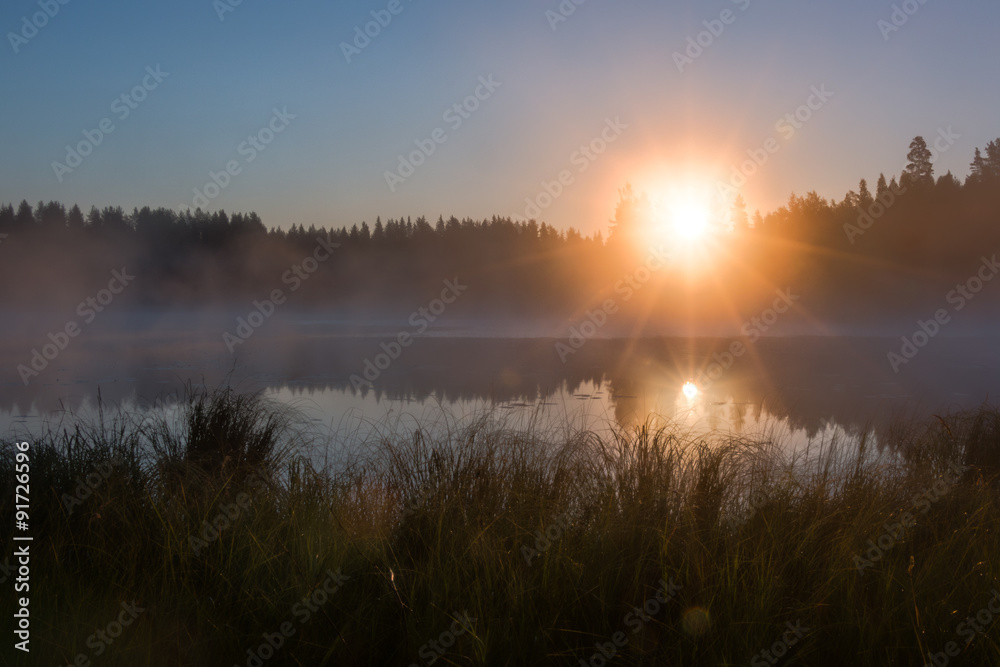 HDR shot of foggy sunrise at a lake