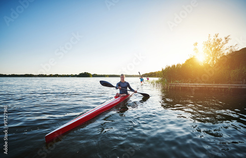 Woman kayaking on a lake