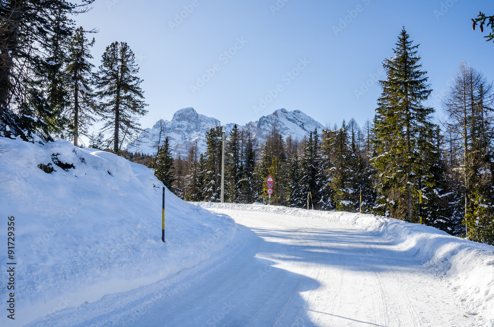 Treacherous Curving Mountain Road Covered in Snow