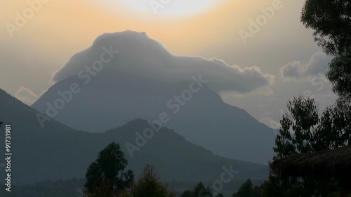 Time Lapse shot of clouds on top of the Virunga volcano chain on the Rwanda Congo border. photo