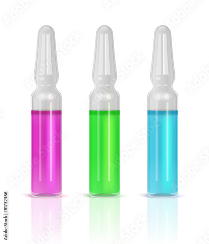 Three ampules with pink, green and blue solutions