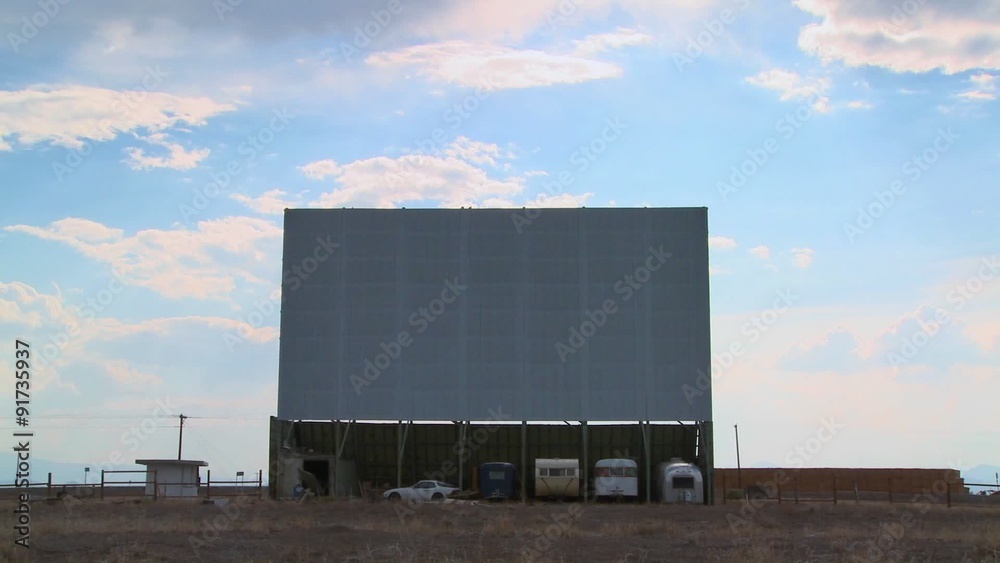 A shot of clouds passing over an abandoned drive in theater screen. A shot of clouds passing over an abandoned drive in theater screen.