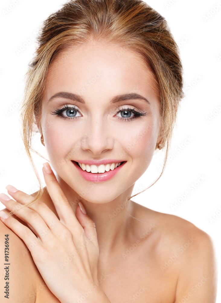 Studio shot of a beautiful young woman with perfect skin against Studio shot of a beautiful young woman with perfect skin against