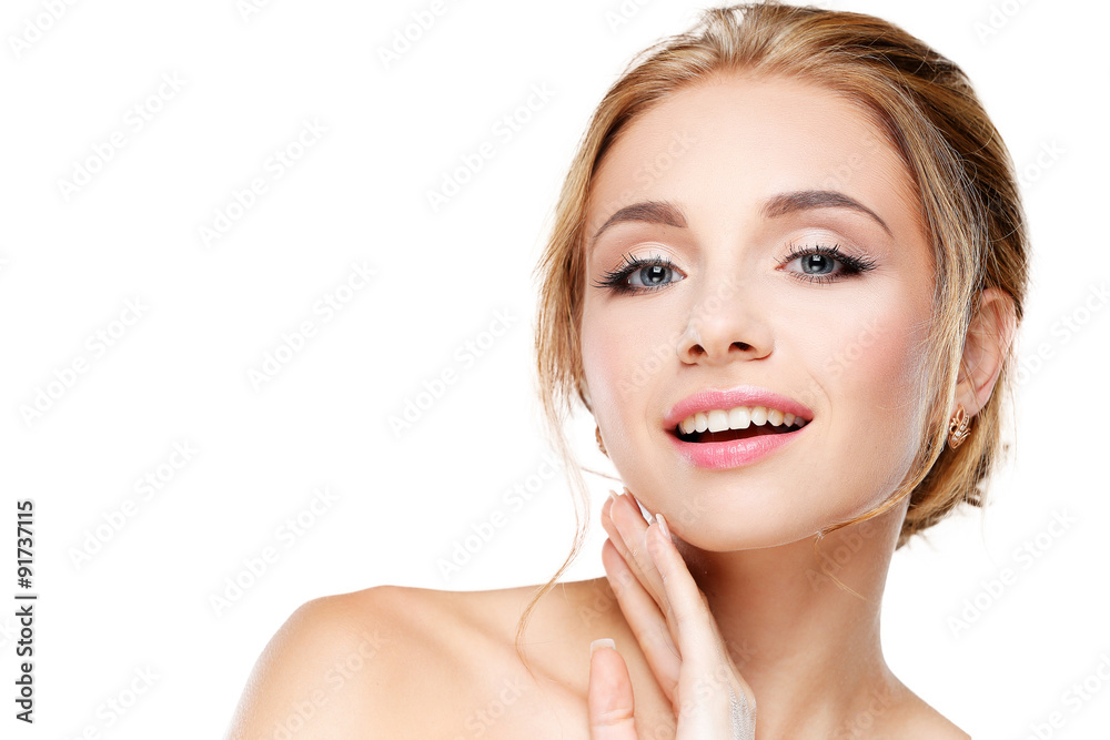 Studio shot of a beautiful young woman with perfect skin against Studio shot of a beautiful young woman with perfect skin against