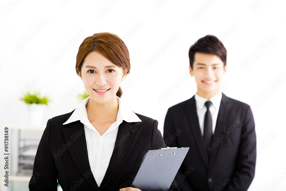 happy business man and woman standing in office happy business man and woman standing in office