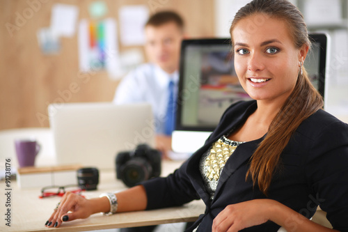 Portrait of an attractive young businesswoman sitting at her dek