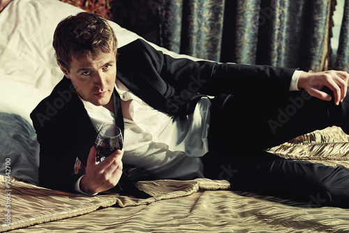 man on a bed photo