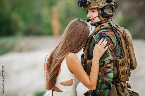 Tableau sur toile woman and soldier in military uniform say goodbye