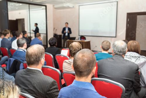 Audience at the conference hall. Business presentation.