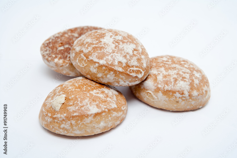 Four gingerbread cookies on white background