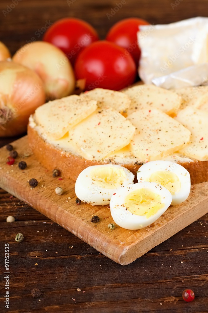 Three halves of quail eggs on chopping board Three halves of quail eggs on chopping board