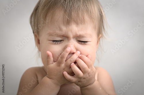 dramatically crying baby portrait