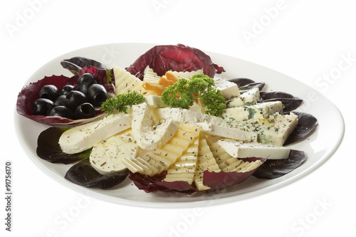 Collection of cheeses. Appetizer of five different kinds of cheese served on a white plate. Isolated on white.