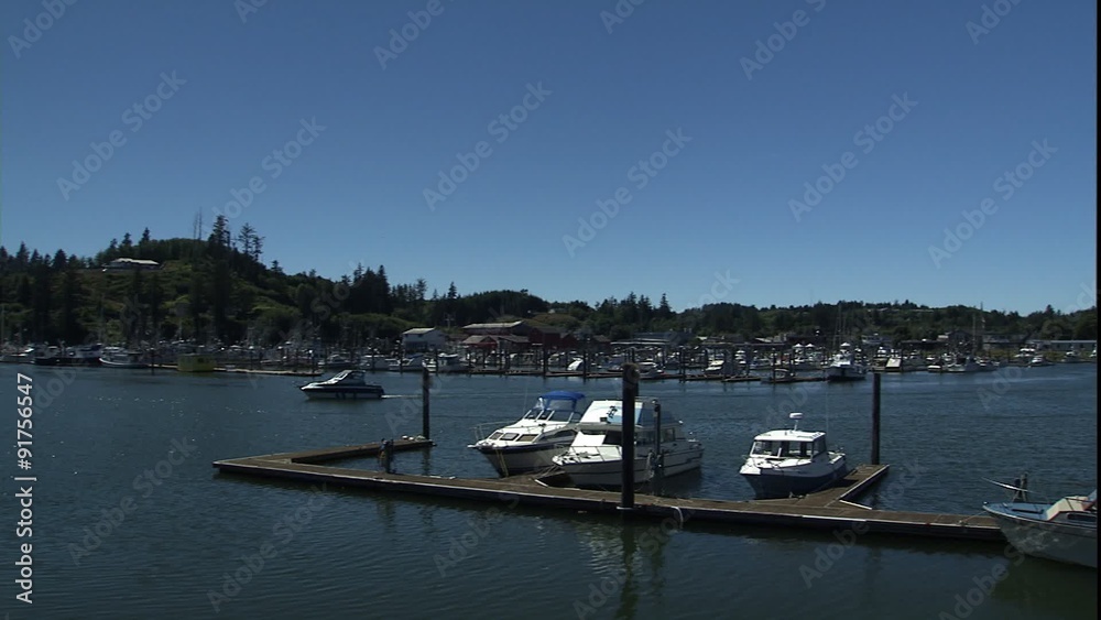 follow boat in Ilwaco, Washington harbor follow boat in Ilwaco, Washington harbor