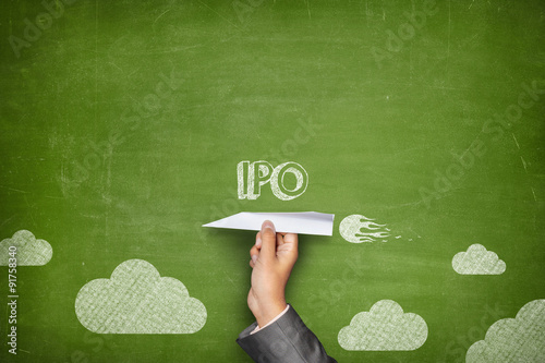 IPO concept on blackboard with paper plane photo