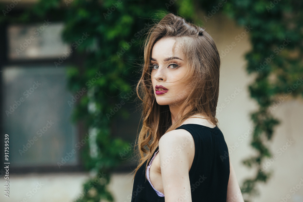 Naklejka premium Attractive fashion woman in black dress