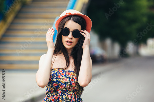 beautiful girl poses for camera in the city
