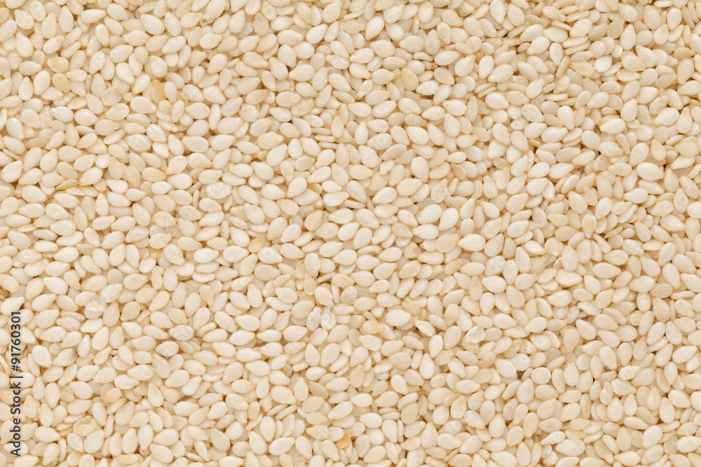 Organic Sesame white (Sesamum indicum) closeup background texture. Organic Sesame white (Sesamum indicum) closeup background texture.