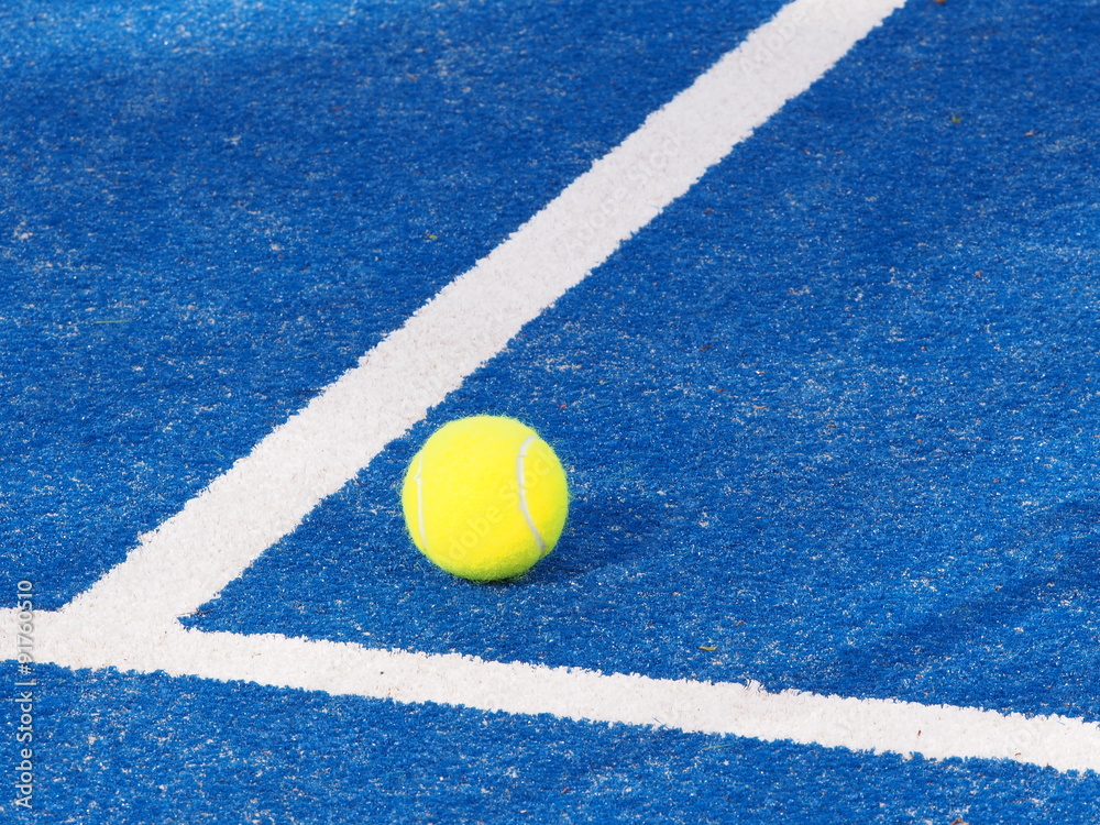 Single Tennis ball on a blue artificial grass court where lines meet, Melbourne, Australia 2015