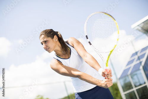 Young woman playing tennis