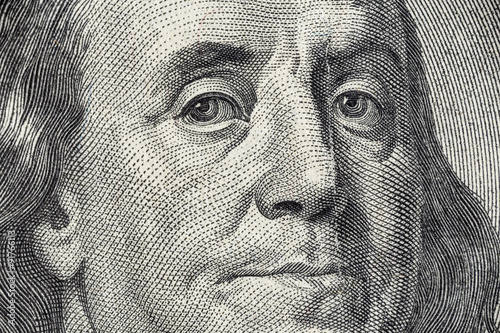 Benjamin Franklin's face on the US 100 dollar bill photo