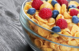 Corn flakes with fresh berries in bowl