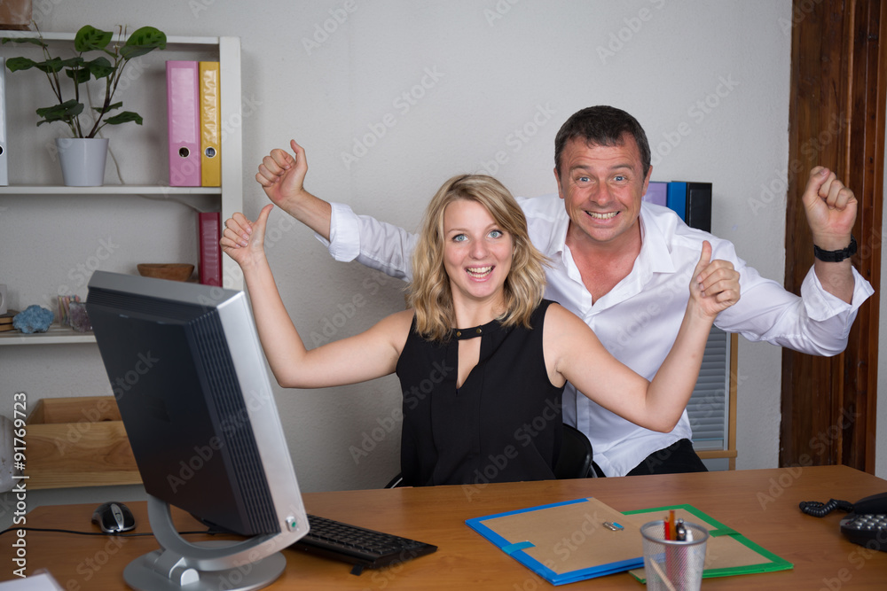 Man and woman having fun at office , success business Man and woman having fun at office , success business