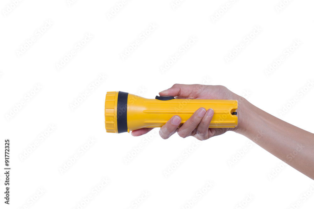 Hands hold yellow flashlight with clipping path Hands hold yellow flashlight with clipping path