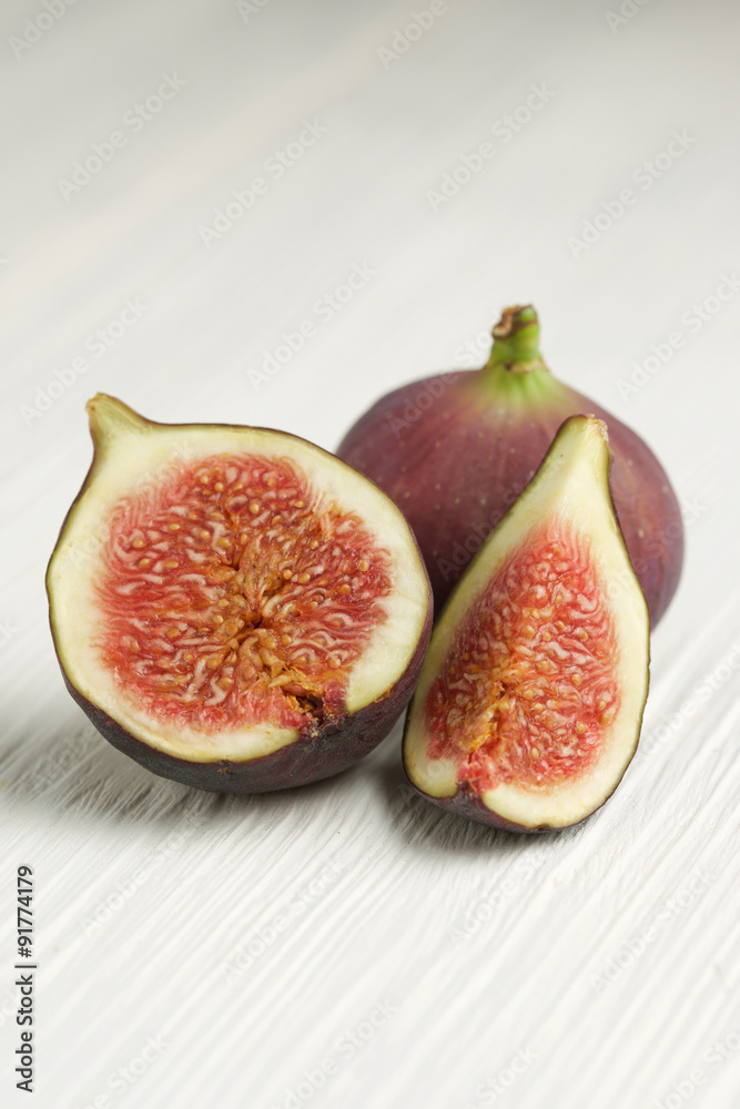 figs on white wooden background figs on white wooden background