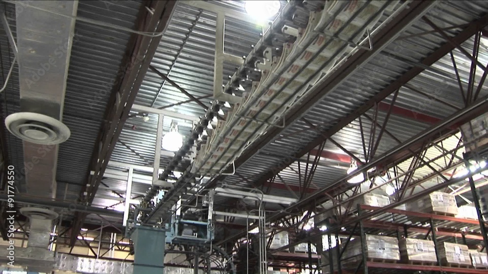 Newspapers flow along an assembly line in a newspaper factory. Newspapers flow along an assembly line in a newspaper factory.