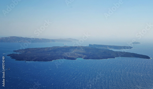 View of the Santorini caldera and Nea Kameni, which is the volcano island in the middle on the cyclades islands.