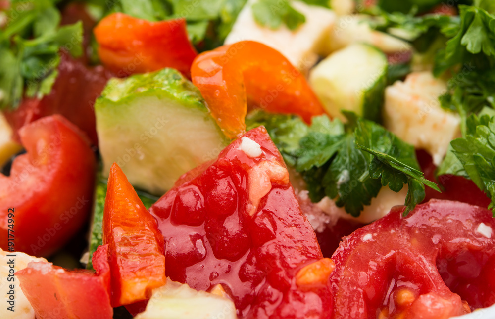 Fresh salad with tomatoes, cucumber and cheese cubes Fresh salad with tomatoes, cucumber and cheese cubes