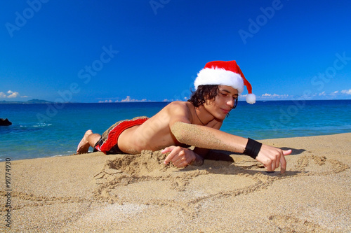 Fotografía Santa Claus on beach of ocean of Atlantic ocean