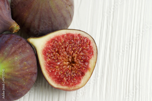 fresh figs on white wooden background