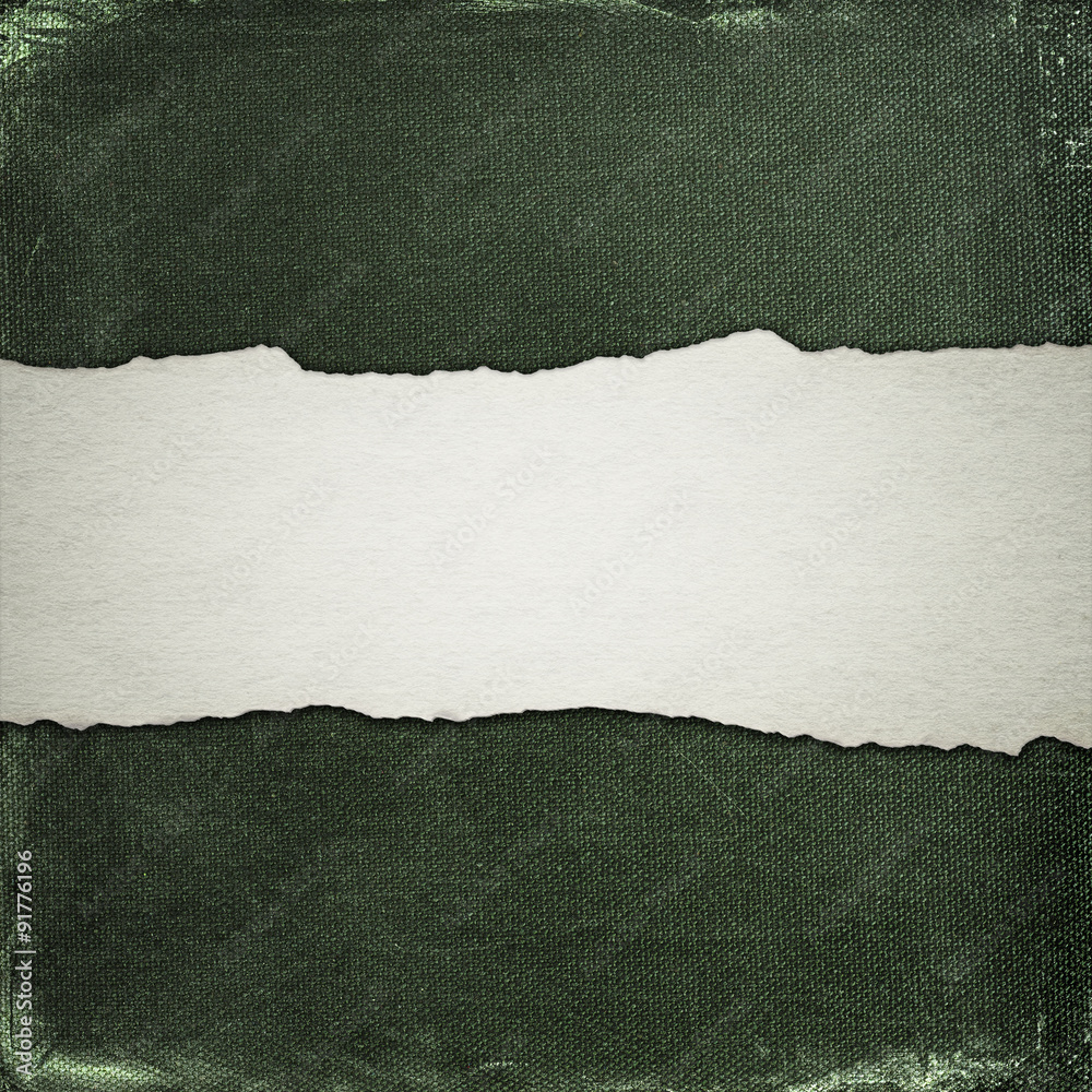 Old cotton background with strip of torn paper Old cotton background with strip of torn paper