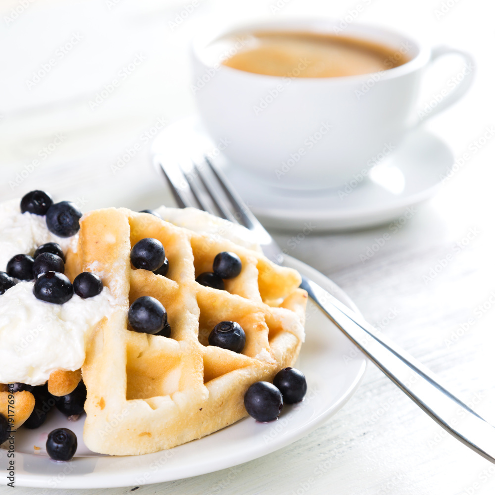 Coffee and Belgian waffles with blueberries. Breakfast Coffee and Belgian waffles with blueberries. Breakfast