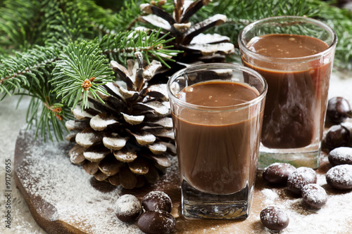 Chocolate drink, candy, pine-needles and cones, selective focus