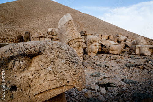 Carved stature heads at west terrace of Mount Nemrut in Turkey. photo