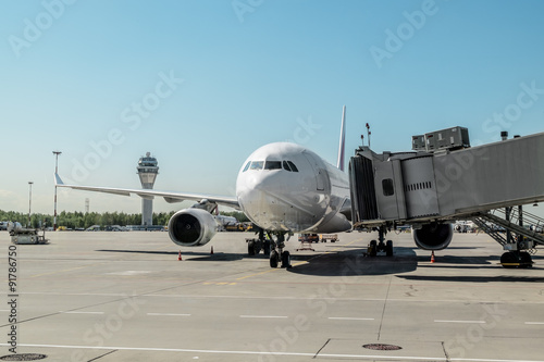 Plane with boarding ramp at the airport Pulkovo.Russia.